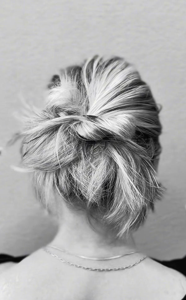 For further styling continue twisting and tucking the  hair around and through the HEKTUX.