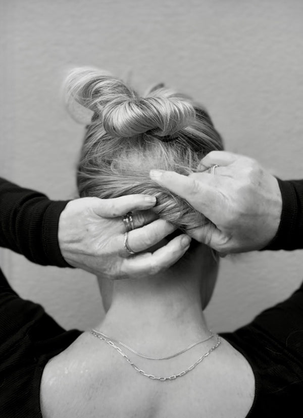 To continue styling hair up, twist the next layer. TIP:  For thicker hair we suggest using consecutive layers